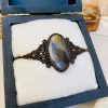 Falcon eyes set with brown macrame bracelet/pendant necklace - Image 2